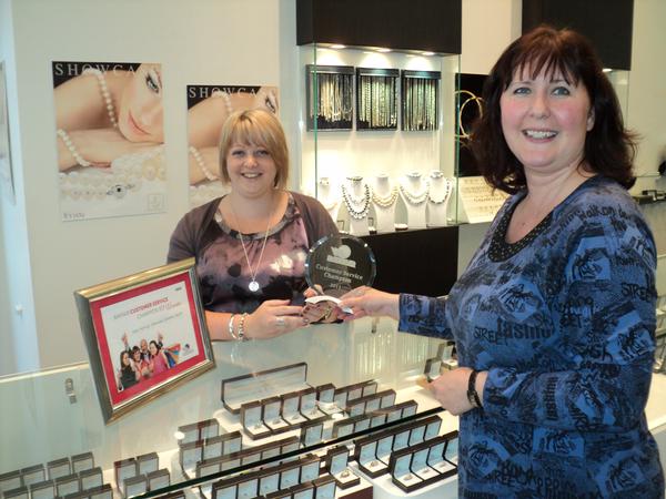 Bayfair Customer Service Champion 2011 Kelly Mohring is presented her trophy by Nina Rivett Bayfair marketing manager
